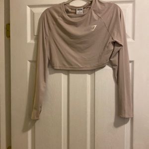 Gymshark size small! Tan athletic shirt. Cropped with thumb holes.